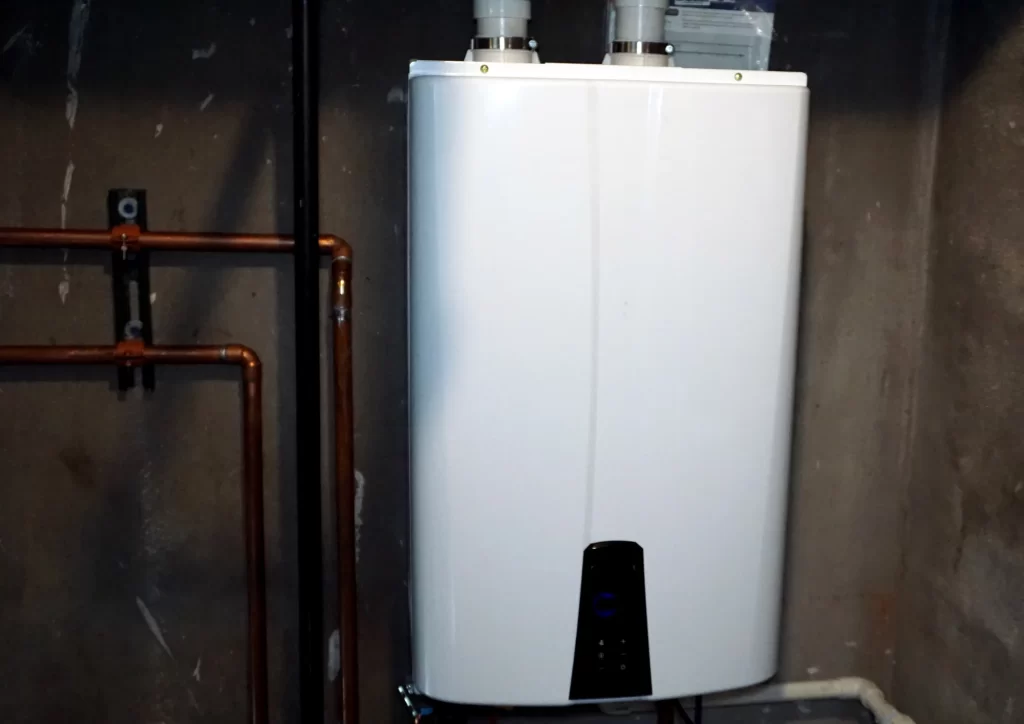 Modern tankless hot water heater installed by NWA C&S Plumbing providing energy-efficient home heating