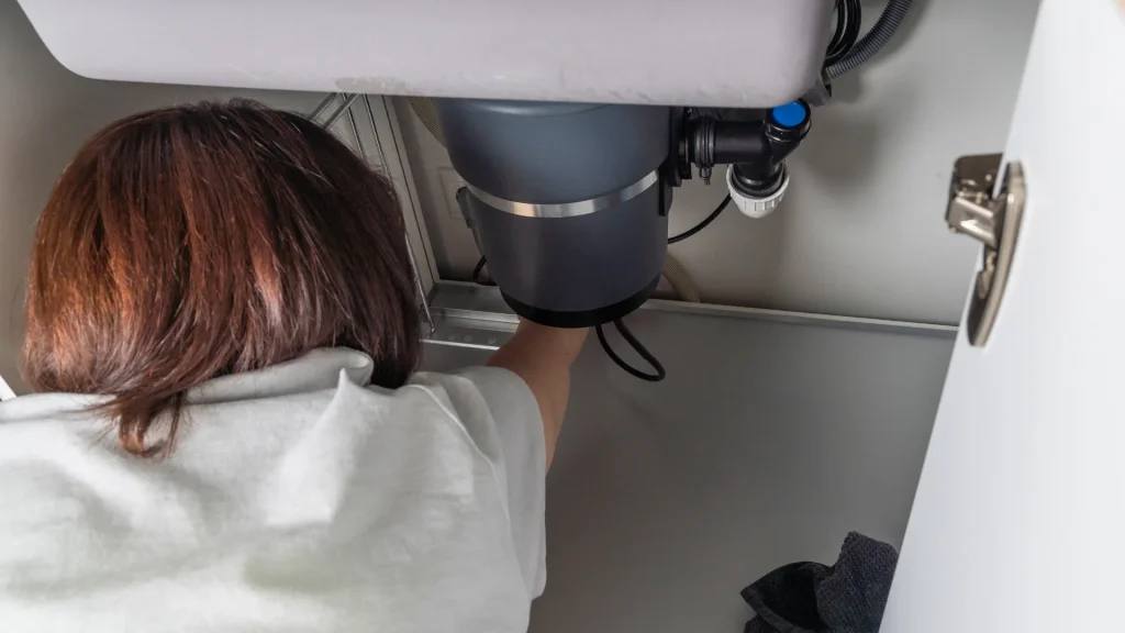 Jammed garbage disposal under kitchen sink